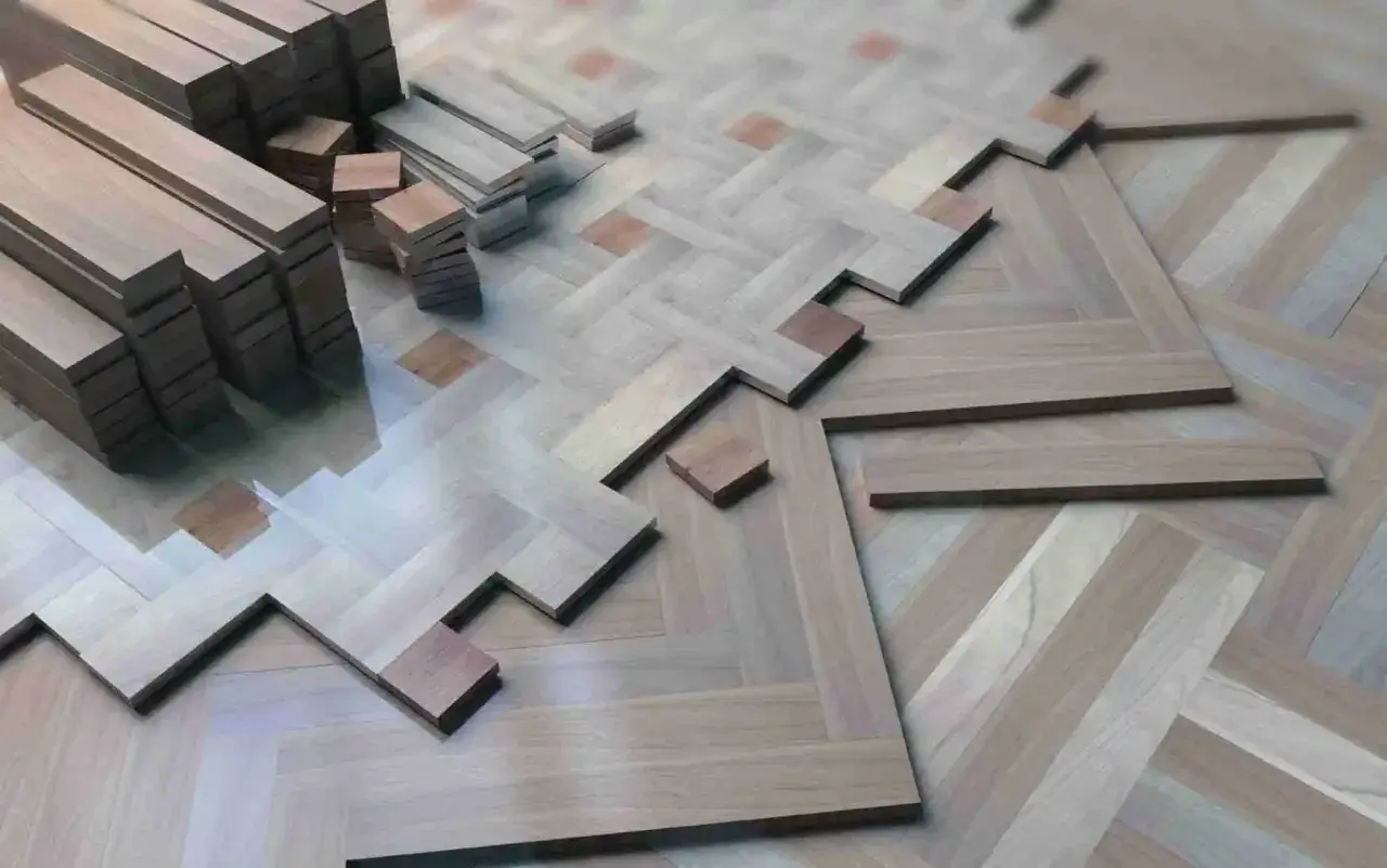 Tablas de parquet de madera apiladas y en proceso de instalación, formando un patrón de espiga. ¿Cuántas veces se puede acuchillar el parquet antes de que se desgaste?