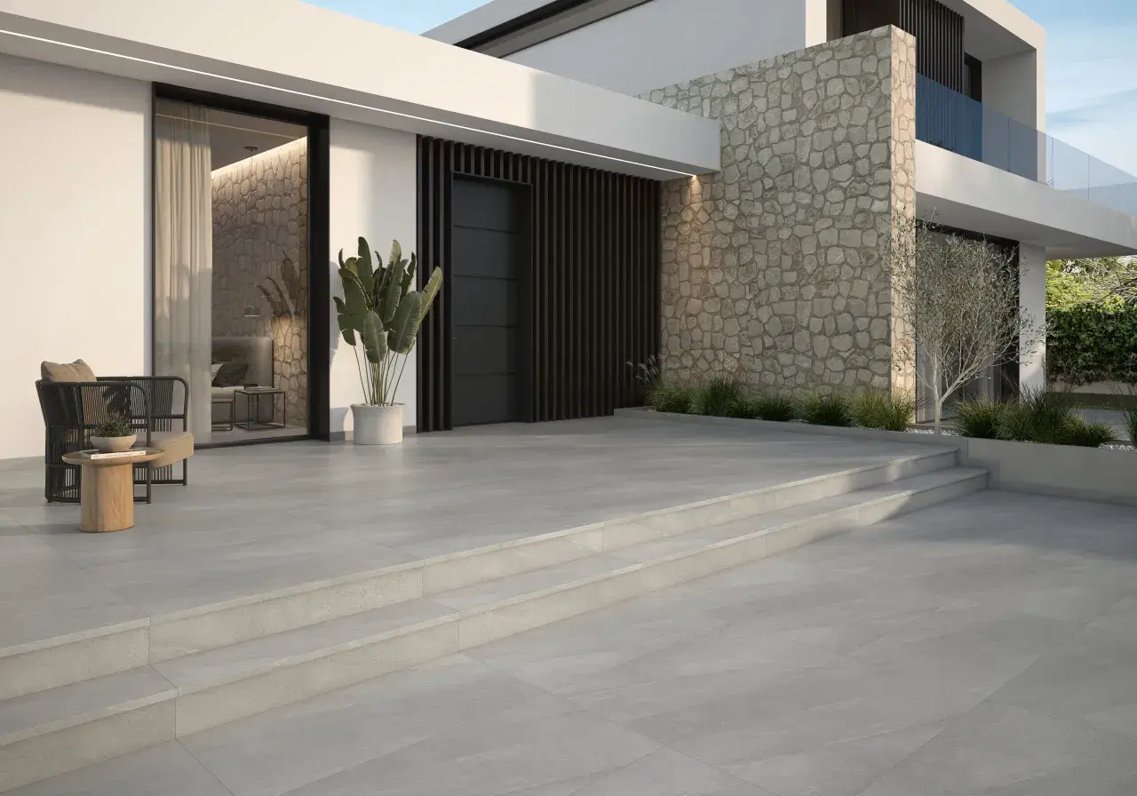 Elegantes suelos para entradas de casas, con escalones de piedra y un diseño moderno que invita a entrar.