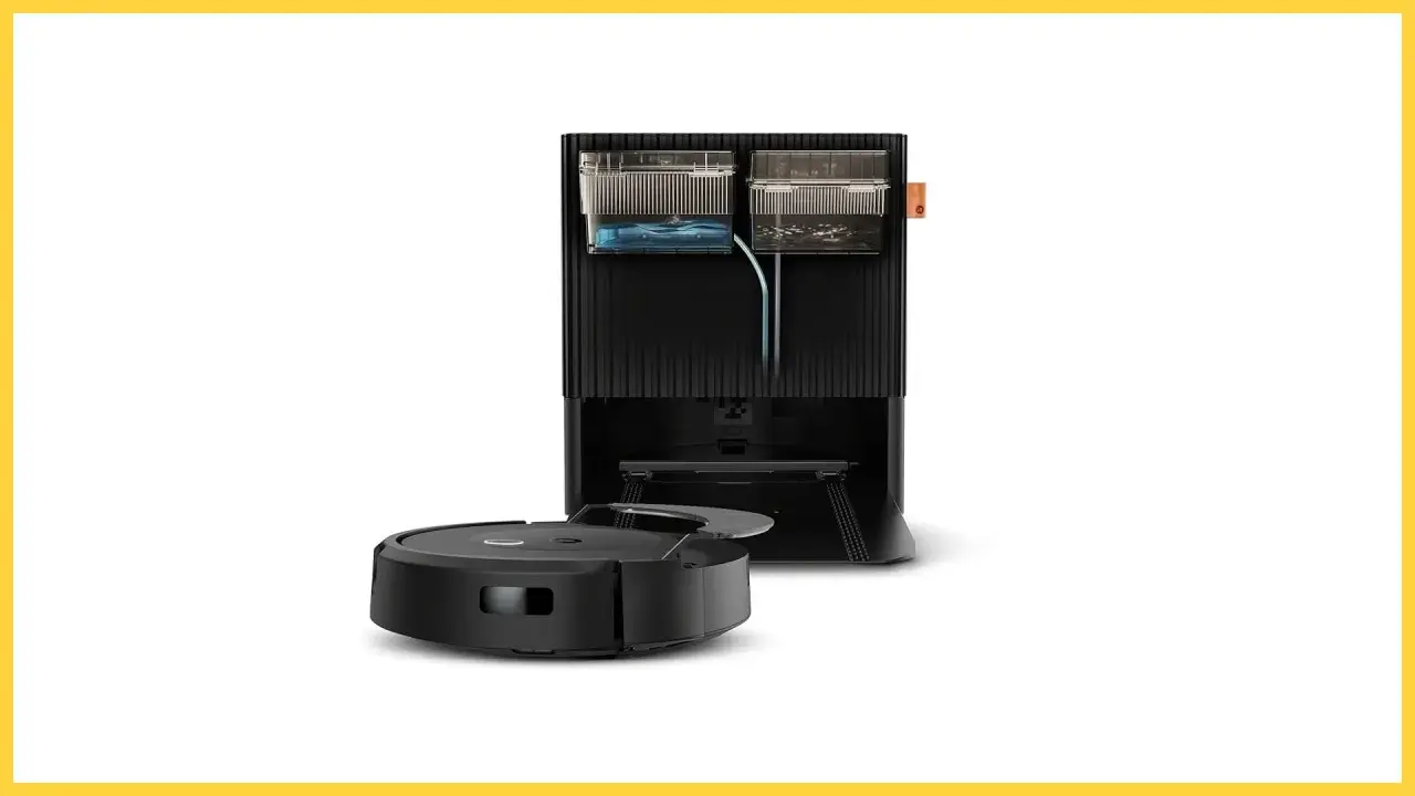 Robot aspirador negro junto a su base de carga, que incluye depósitos de agua y suciedad, creando una zona de exclusión para el polvo.